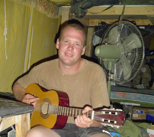 Jason Moon_Playing guitar in Iraq